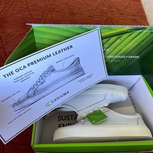 Brand new in box white leather Cariumas. Women’s size 8